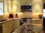 granite-counters-and-marble-backsplash