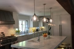 Carrara marble kitchen with large bevel backsplash