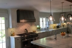 Carrara marble counters with 4x8 white bevel subway