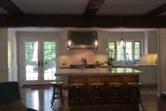 Carrara marble counter tops with retro large bevel white subway tile