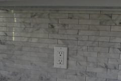 Elongated Carrara marble mini brick mosaic