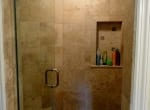 Travertine with Green Iridescent Glass Accents